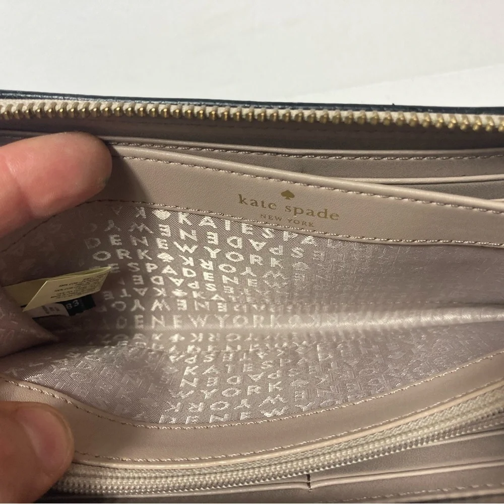 Kate Spade wallet pebble texture leather mauve color black trim tassel